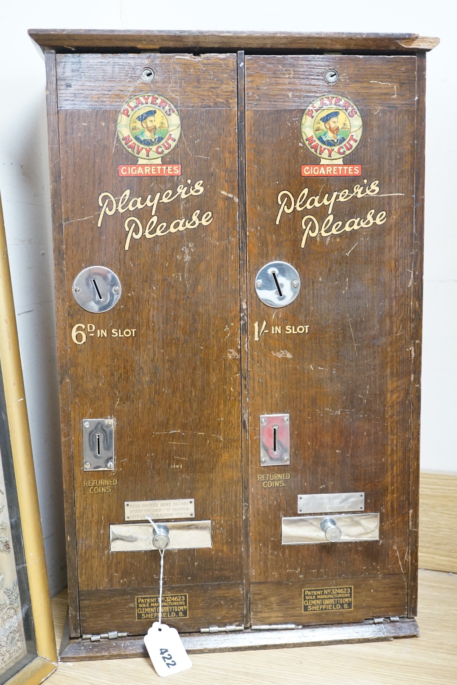 A ‘Players Please’ cigarette vending machine, 60cms x 38cms